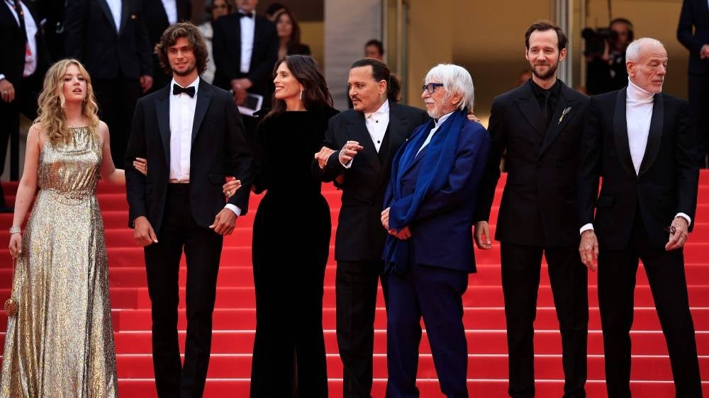 (From L) German actress Pauline Pollmann, French actor Diego Le Fur, French actress and director Maiwenn, French actor Pierre Richard, US actor Johnny Depp, French actor Benjamin Lavernhe and French actor Pascal Greggory pose as they arrive for the opening ceremony and the screening of the film "Jeanne du Barry" during the 76th edition of the Cannes Film Festival in Cannes, southern France, on May 16, 2023. (Photo by Valery HACHE / AFP)