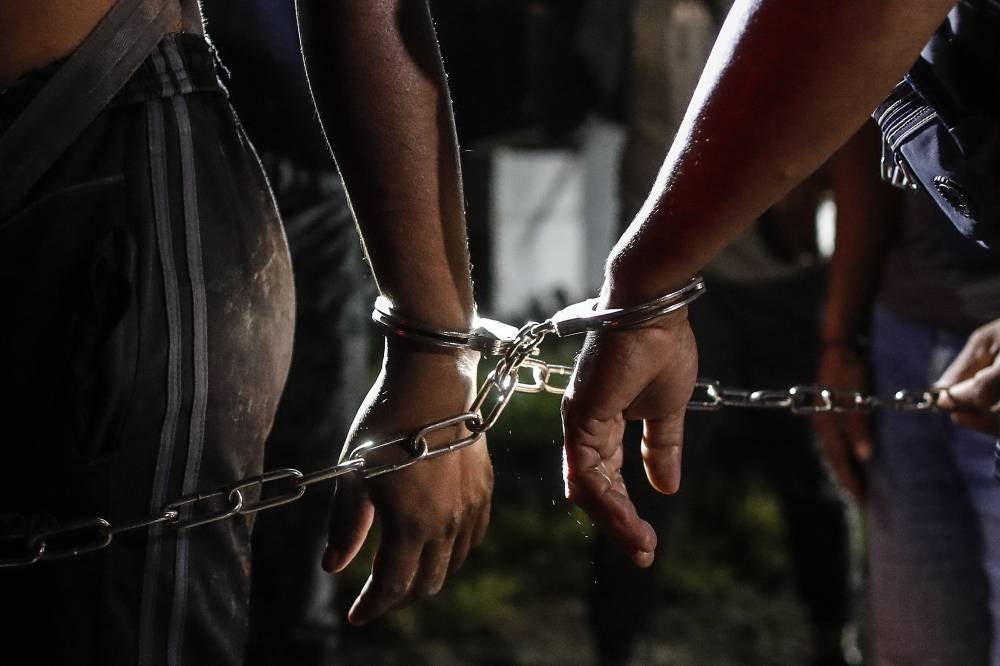  Kuala Lumpur Immigration director Syamsul Badrin Mohshin said the 48-year-old suspect’s year-old operation was busted when they raided the house at 11 am in Ops Serkap. - EPA/FAZRY ISMAIL