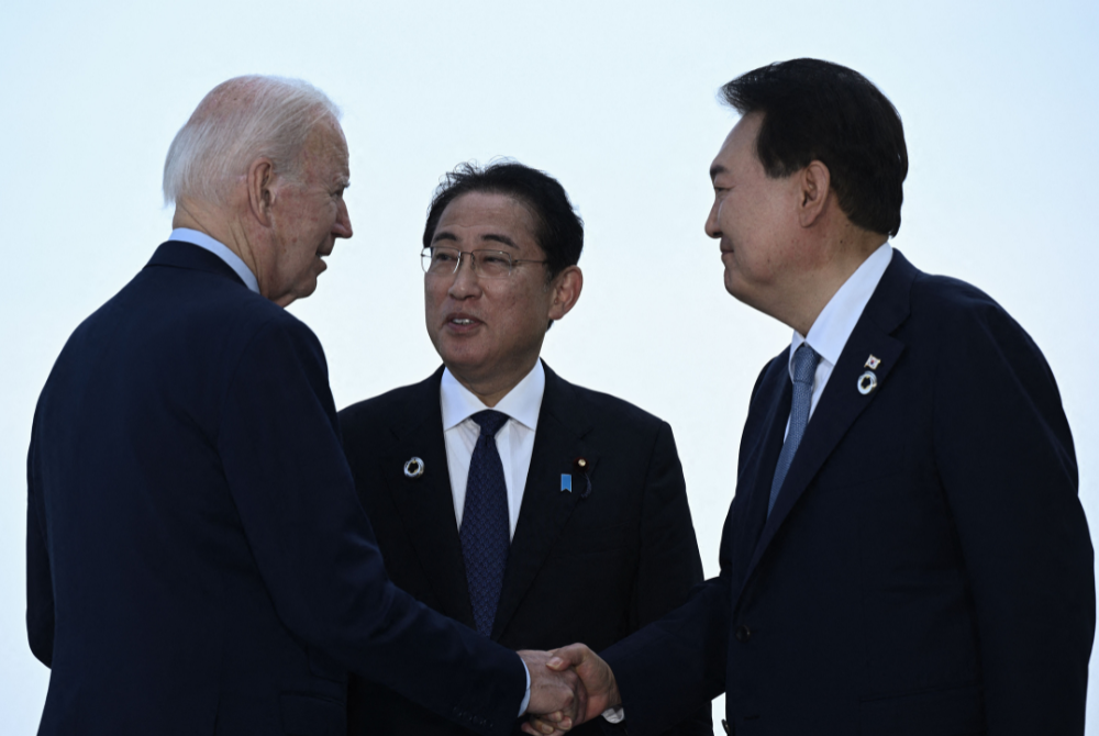 (From left to right) US President Joe Biden, Japan's Prime Minister Fumio Kishida, and South Korea's President Yoon Suk Yeol gather for a trilateral meeting during the G7 Leaders' Summit in Hiroshima on May 21, 2023. Photo: AFP
