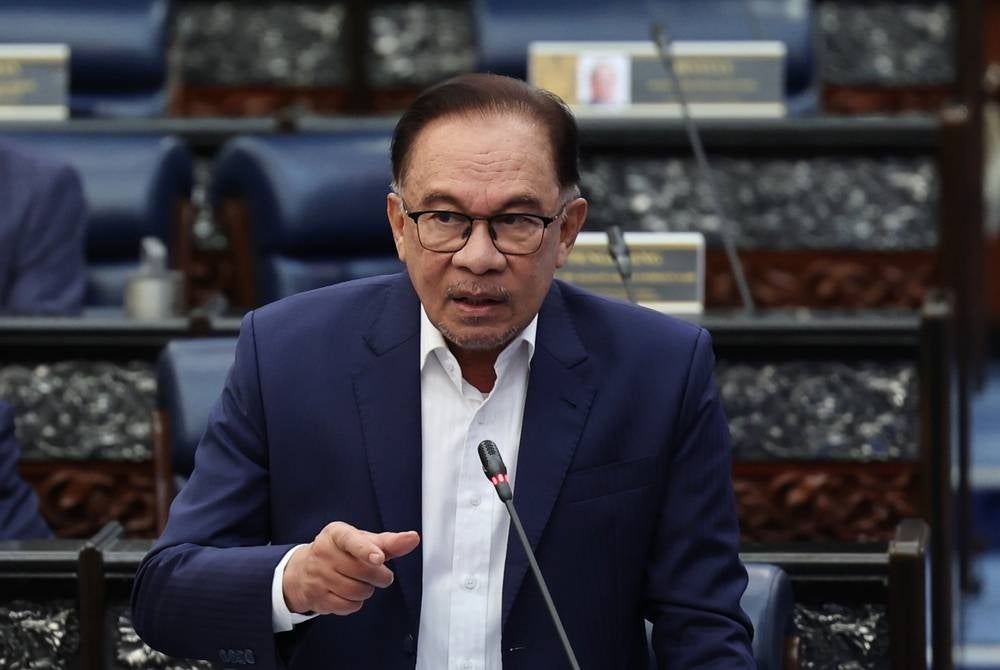 Prime Minister Datuk Seri Anwar Ibrahim who is also the Finance Minister answering questions at the Parliament. - BERNAMA