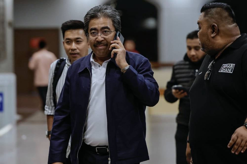 Umno vice president Datuk Seri Johari Abdul Ghani arrives at the party headquarters for the Supreme Council meeting at Menara Dato’ Onn, World Trade Centre here tonight - BERNAMA