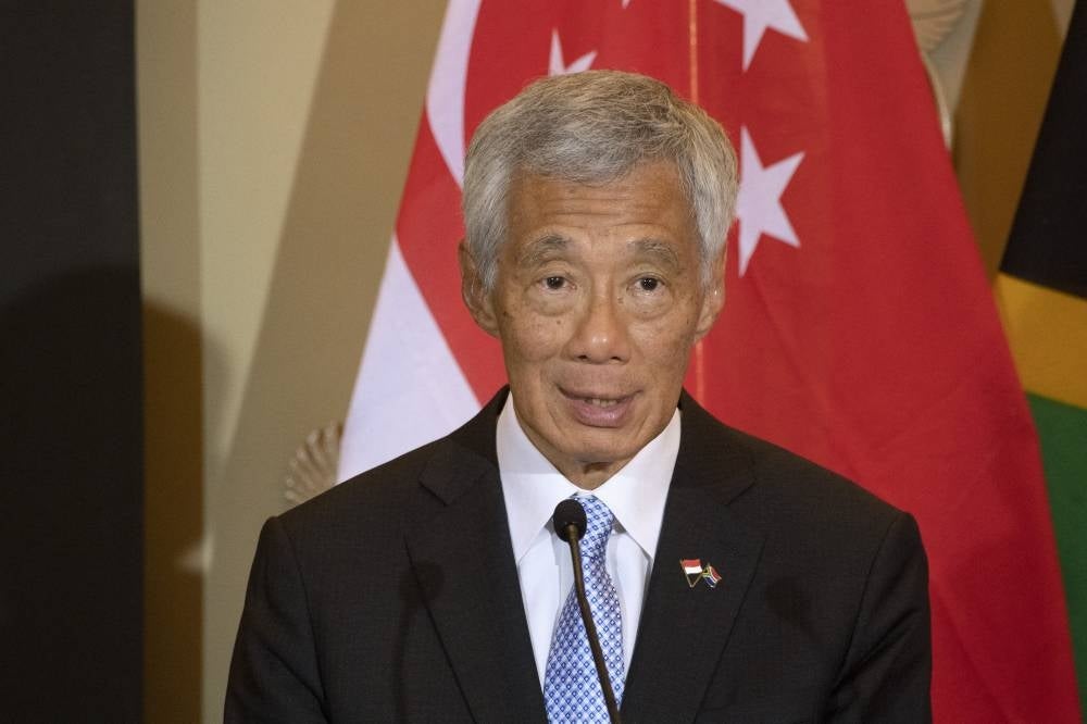 Singapore Prime Minister Lee Hsien Loong is experiencing a Covid-19 ‘rebound’, after showing his last negative result on Sunday and returning to work on Monday. - Photo: AFP