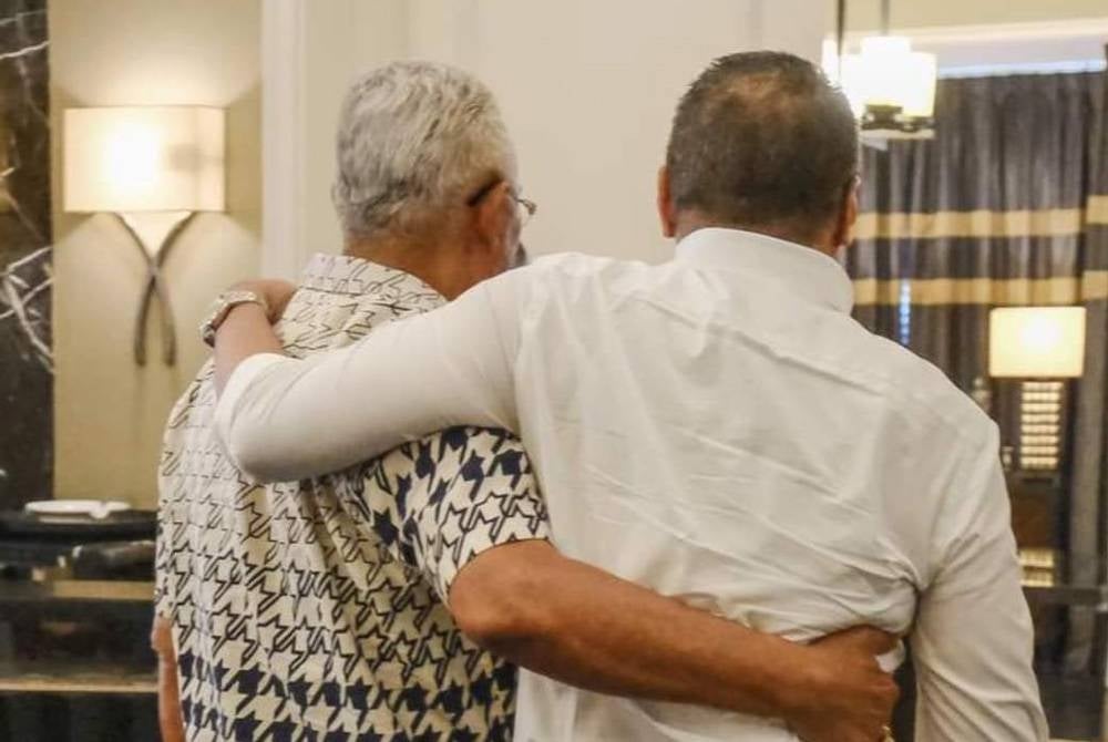 Datuk Seri Hishammuddin Tun Hussein Hishamuddin is seen here sharing a hug with his comrade Tan Sri Noh Omar - Hishamuddin's Facebook