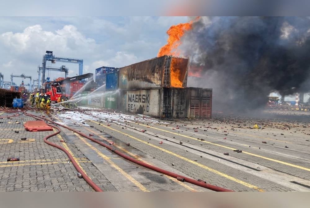 Firemen extinguishing the fire at North Port, Klang, Selangor on Wednesday - FILEPIC 