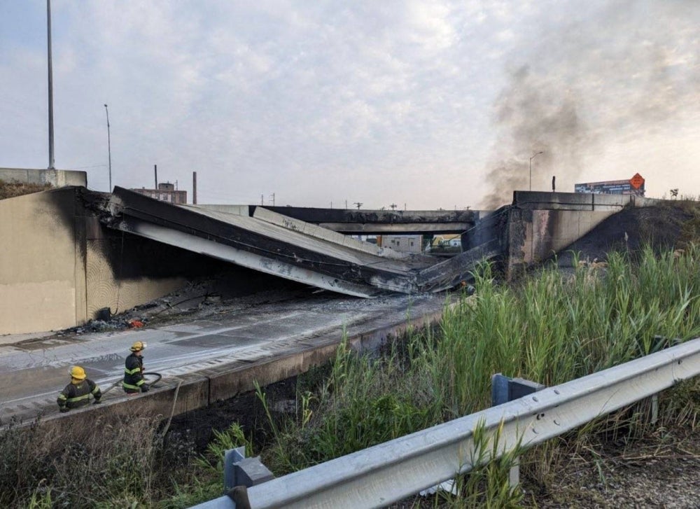A portion of collapsed road caused by a large vehicle fire in Philadelphia, Pennsylvania. The collapse took out four traffic lanes along an elevated section of the heavily traveled motorway, though no injuries were immediately reported. (Photo by Handout /Philadelphia Office of Emergency Management /AFP)
