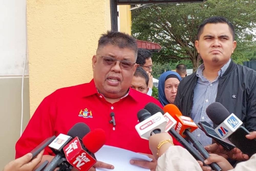 Umno Supreme Council member Datuk Seri Ab Rauf Yusoh talking to reporters after delivering the phase two and three One-Off Cost of Living Incentive Payment to 316 fishermen at the Japerun Complex Tanjung Bidara.