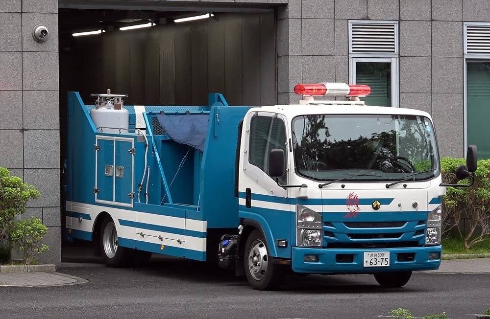 A vehicle from the Nara Prefectural Police, believed to be carrying a suspicious object, is pictured after it was delivered to the Nara District Court during the pre-trial hearing for Tetsuya Yamagami, the man accused of killing Japan's former prime minister Shinzo Abe, in Nara on June 12, 2023. Photo by Jiji Press/AFP.