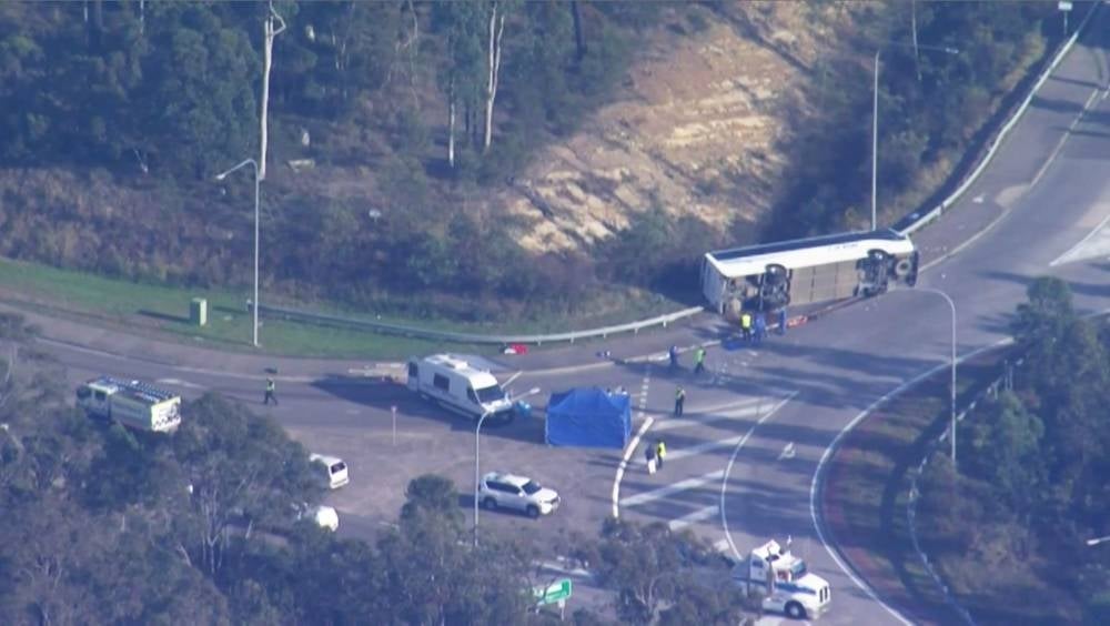 This frame grab taken from video footage provided by Australian Broadcast Corporation (ABC) on June 12, 2023 via AFPTV shows the site of a bus crash, where 10 people from a wedding party were killed, in Cessnock, in Australia's Hunter wine region north of Sydney. Photo by various sources/AFP