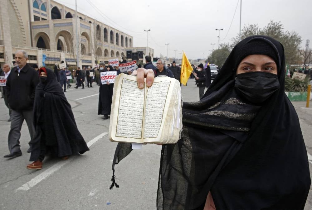 Iranians protest in Tehran on Jan 27, 2023 against the burning of a Koran in Sweden. Swedish-Danish far-right politician Rasmus Paludan set fire to a copy of the Muslim holy book in front of Turkey's embassy in the Swedish capital. Many Muslim countries said they were outraged by the burning of the Koran, which Swedish Prime Minister Ulf Kristersson condemned as "deeply disrespectful". - AFP