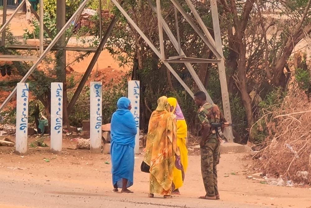 An army soldier talks to women on a street in Khartoum on June 6, 2023, as fighting continues in war-torn Sudan. - File pic by AFP