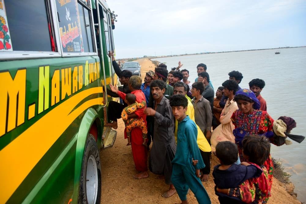 Residents evacuate from a coastal area of Keti Bandar before the due onset of cyclone Biparjoy, in Thatta district of Pakistan's Sindh province on June 13, 2023. - Photo by AFP