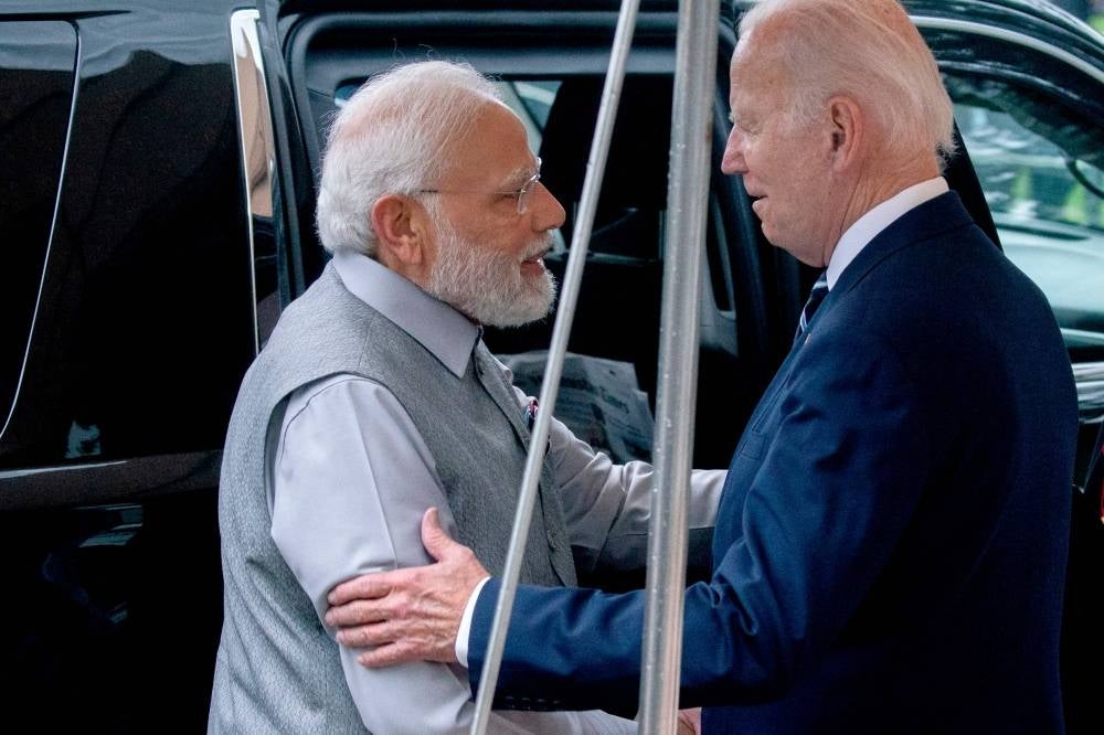 US President Joe Biden (R) greets India's Prime Minister Narendra Modi as he arrives at the South Portico of the White House in Washington, DC on June 21, 2023. Modi is at the White House for a private dinner hosted by US President Joe Biden (Photo by Stefani Reynolds / AFP)