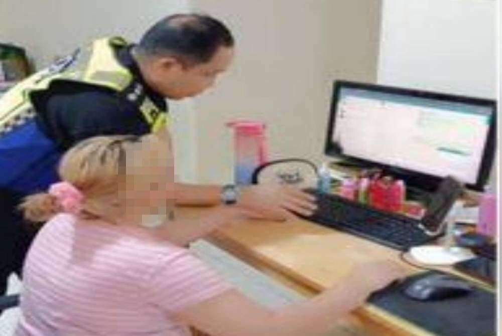 One of the individuals arrested in the gambling premise raid at Jalan Kuchai Lama on Friday - FILE PIX 