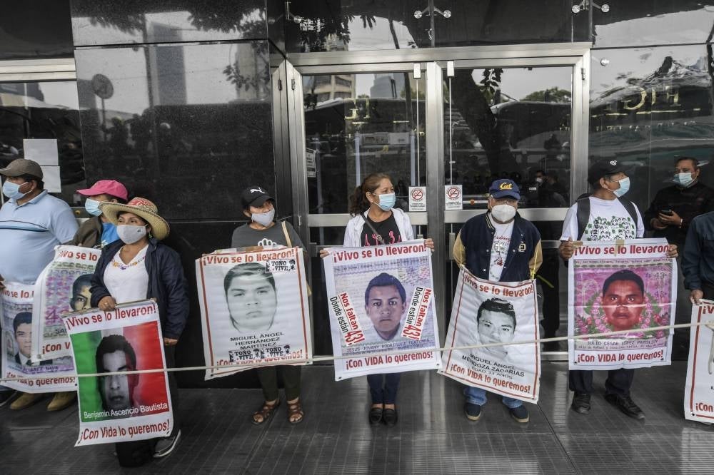 Relatives of some of the 43 missing students of the Ayotzinapa Teacher Training College demonstrate outside the Attorney General's Office in Mexico City on Sept 25, 2020, on the eve of the sixth anniversary of their disappearance. - (Photo by PEDRO PARDO / AFP)