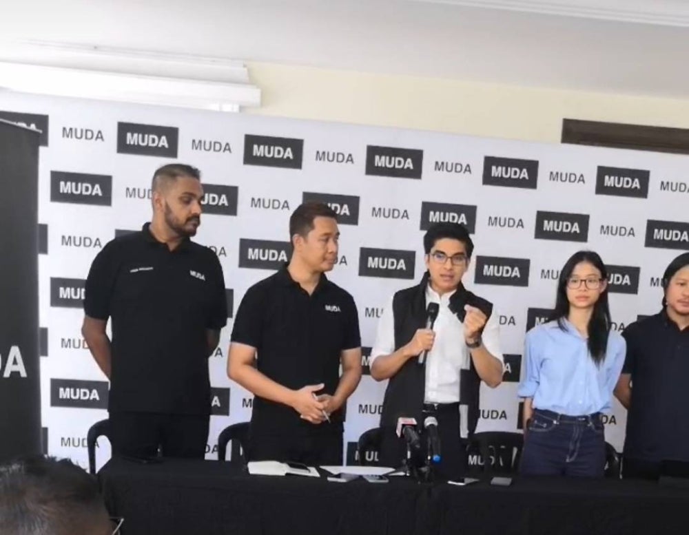Syed Saddiq (centre) at the press conference on Wednesday.