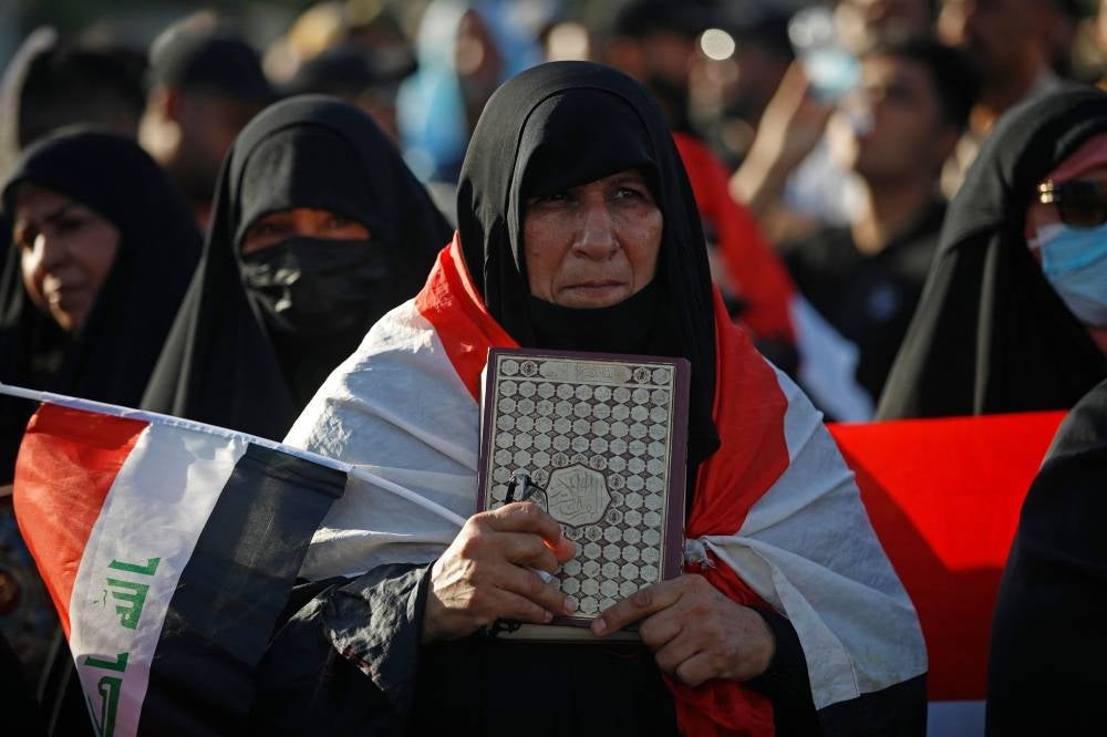 Supporters of Iraq's Sadrist movement gather outside the Swedish embassy in Baghdad on June 30, 2023 for a second day of protests against a Quran burning outside a Stockholm mosque that outraged Muslims around the world. (Photo by Ahmad Al-rubaye / AFP)