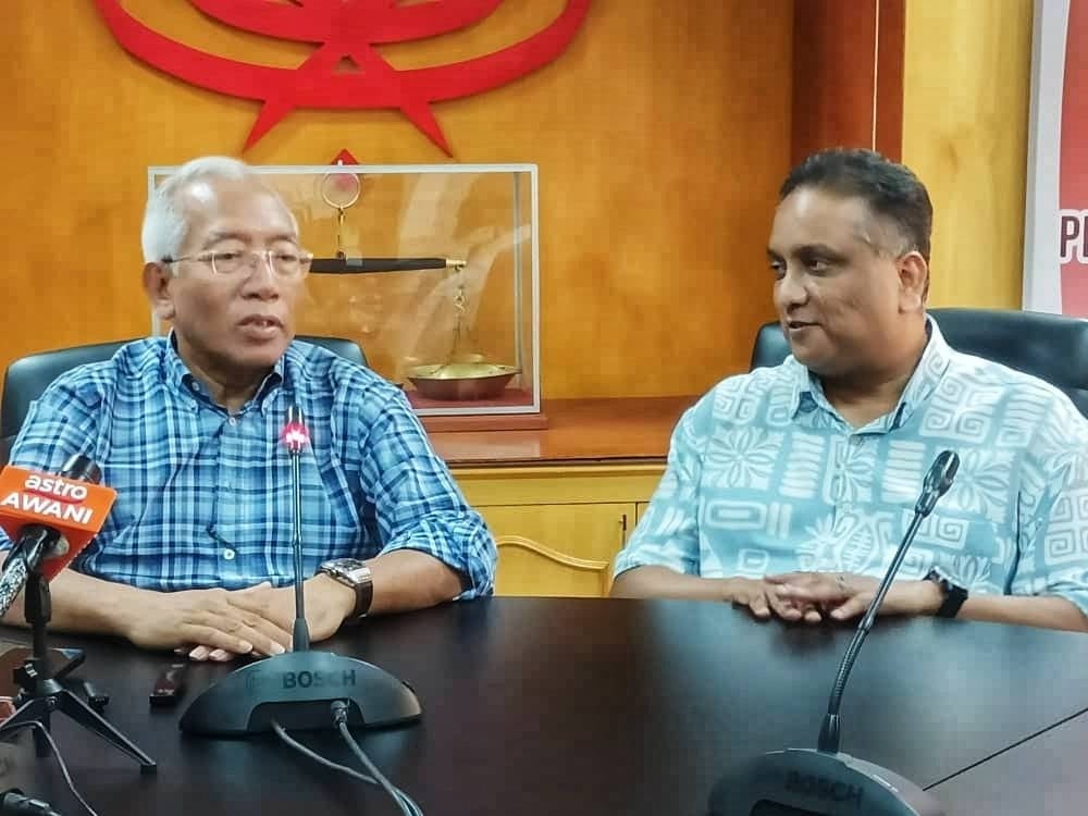 Mahdzir (left) and Reezal Merican during a press conference on Monday.