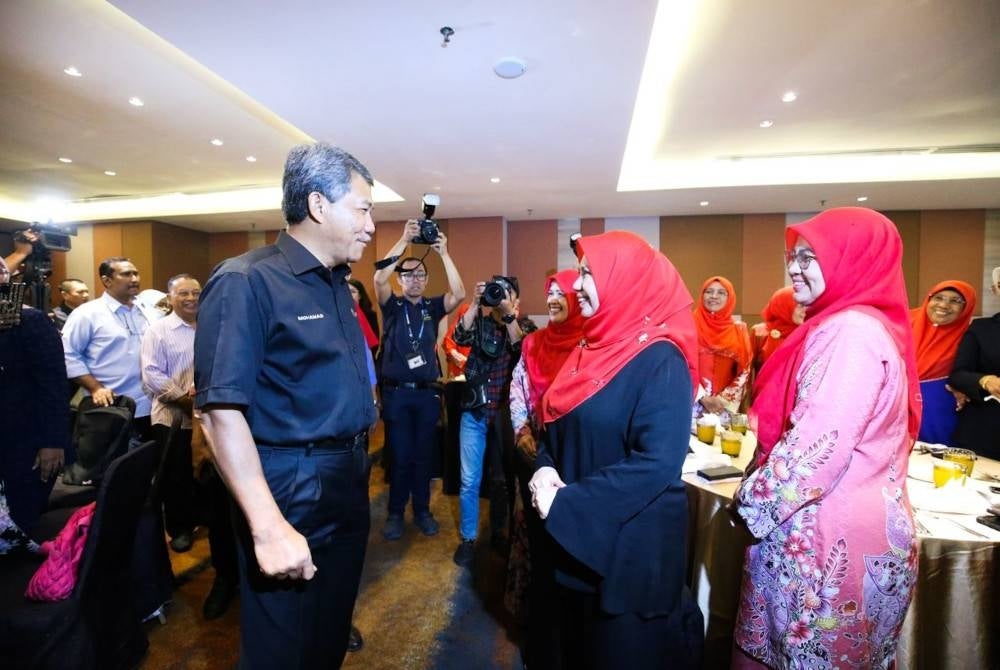 Mohamad with Penang Umno women chief, Datuk Norliza Abdul Rahim, during a closed-door meeting with the leaders of Umno Penang on Monday.