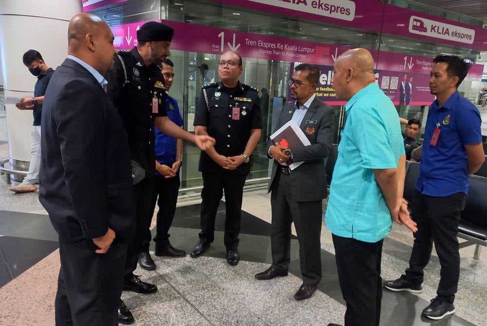 Adnan performing a visit to KLIA1 to inspect Immigration Department officers operating on Tuesday.