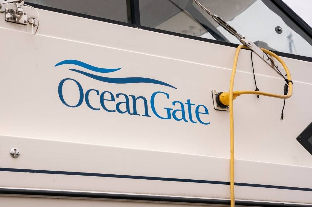 The OceanGate logo is seen on a vessel stored near the OceanGate offices on June 21, 2023 in Everett, Washington. OceanGate, is the owner of the submersible which carried five people trying to visit the Titanic wreckage in the North Atlantic - AFP