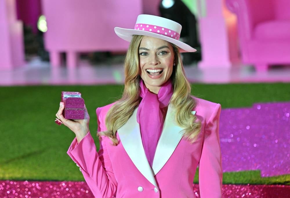 Australian actress Margot Robbie poses for a photo during a pink carpet event to promote her new film "Barbie" in Seoul on July 2, 2023. (Photo by Jung Yeon-je / AFP)