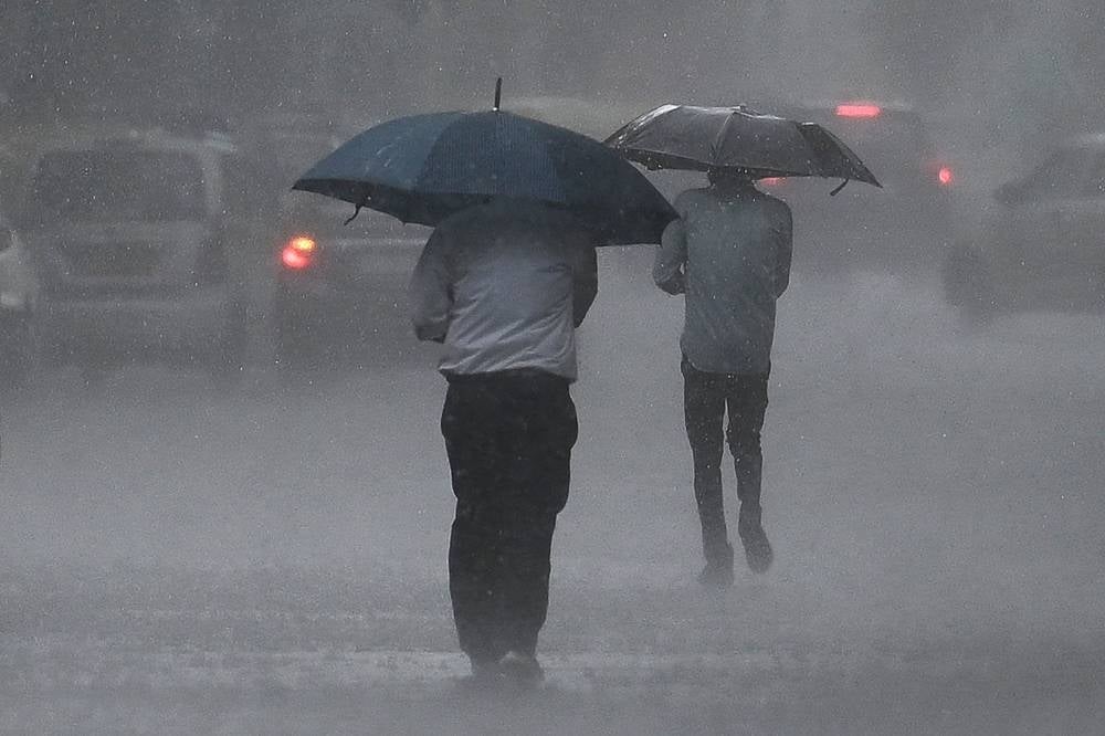 The rains that hit New Delhi on Saturday were the heaviest one-day rainfall in the last 20 years. (Photo by Arun SANKAR / AFP)