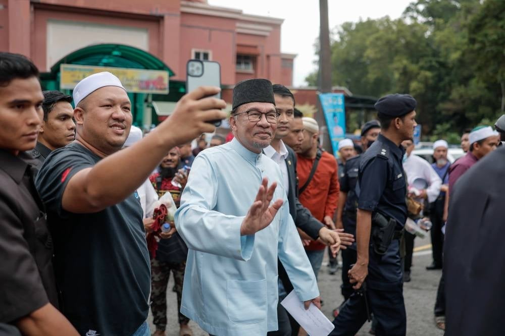 Prime Minister Datuk Seri Anwar Ibrahim at the Al-Khairiyah mosque in Taman Sri Gombak to perform Friday prayers, yesterday. - Photo by Bernama