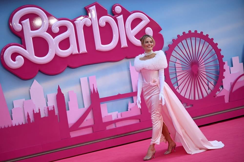 Australian actress Margot Robbie poses on the pink carpet upon arrival for the European premiere of "Barbie" in central London on July 12, 2023. Photo by Justin Tallis/AFP