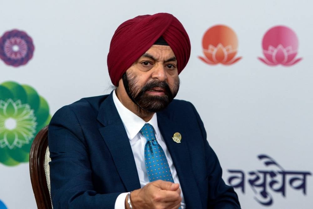 World Bank Chief Ajay Banga gestures as he speaks during a press briefing at the G20 Finance Ministers, Central Bank Governors (FMCBG) and Finance & Central Bank Deputies (FCBD) meetings at the Mahatma Mandir in Gandhinagar on July 18, 2023. (Photo by Sam PANTHAKY / AFP)