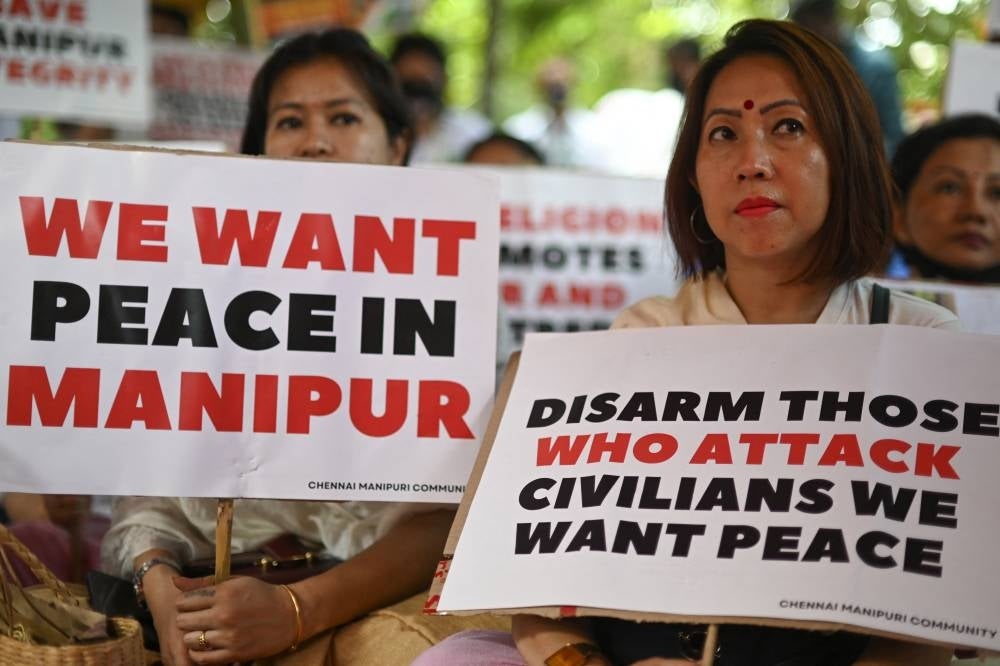 Members of the 'Chennai Manipuri community' hold a peace demonstration to protest in solidarity with the people of India’s northeastern state of Manipur amid ethnic violence, in Chennai on July 9, 2023. - (Photo by R.SATISH BABU / AFP)