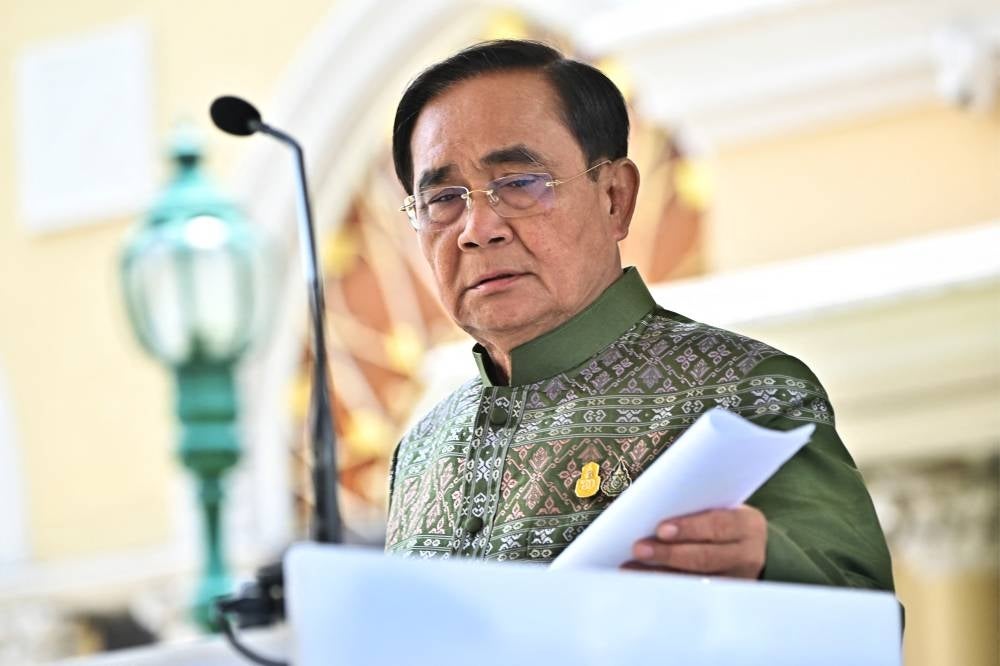 Thai prime minister Prayut Chan-O-Cha speaks to the press after a cabinet meeting at Government House in Bangkok on May 16, 2023. - (Photo by LILLIAN SUWANRUMPHA / AFP)