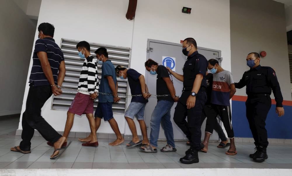 SHAH ALAM, July 24 -- Six Indonesian construction workers, Mohamad Sawi, 19, Marco, 24, Ahmad, 32, Marhadi, 35, Pusidin, 42, and Mohammad, 46, were charged in the Magistrate's Court today on charges of killing a fellow countryman. - Photo by Bernama 