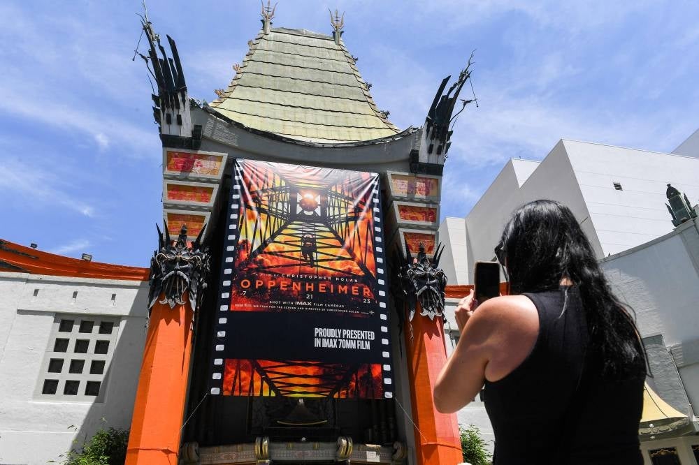 Banners for director Christopher Nolan's new film, Oppenheimer, are seen on the Chinese Theater on the Hollywood Walk of Fame - FILE PIX 