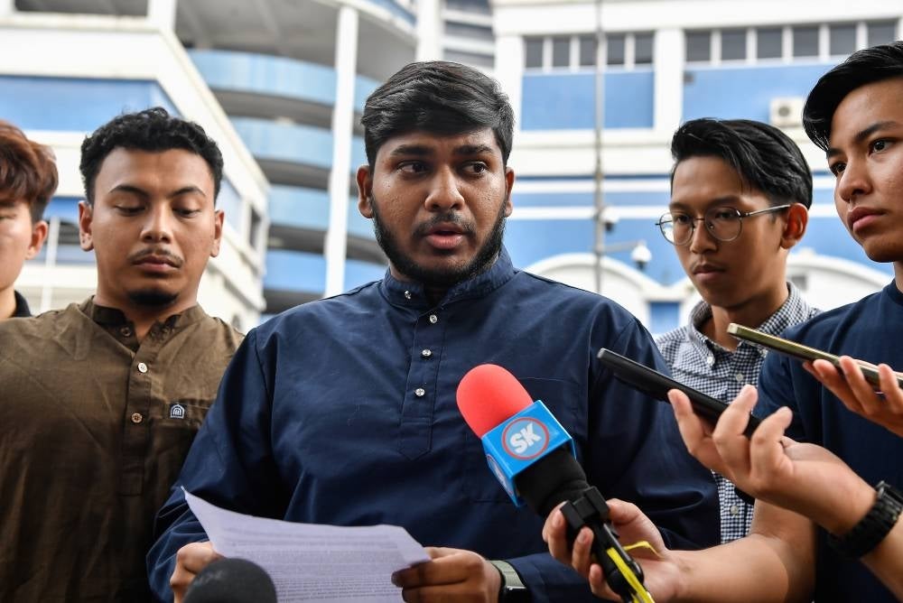 Mahasiswa Keadilan Malaysia vice-president K. Yuveraaj (two, left) during a press conference after lodging a police report at the Dang Wangi District Police Headquarters, today. - Photo by Bernama