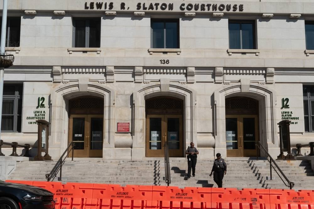 Barriers line the sidewalk in front of the Lewis R. Slaton Courthouse, where former US President Donald Trump is expected to be indicted in the Fulton County district attorney’s election interference investigation, in Atlanta, Georgia, on July 31, 2023. - (Photo by Elijah Nouvelage / AFP)