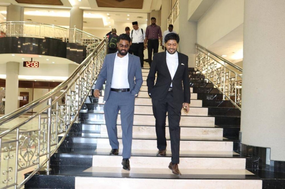 Prabakaran (left) with his lawyer Dinesh Muthal.