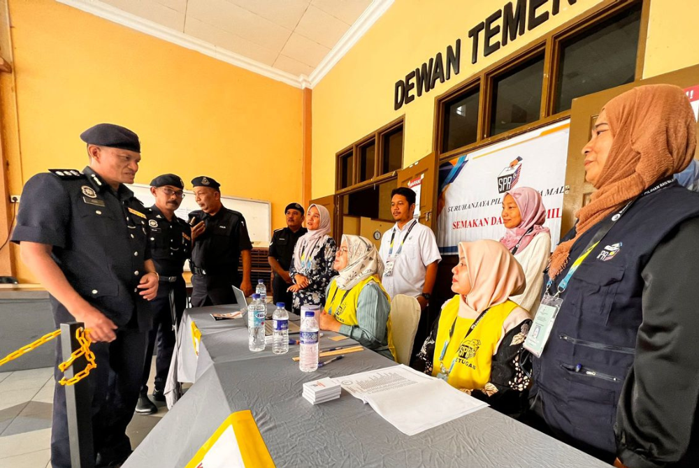 Seberang Perai Utara district police chief Assistant Commissioner Mohd Asri Shafie at the Dewan Temenggung polling centre in Kepala Batas.