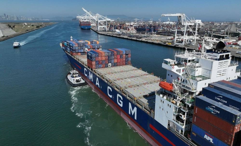 In an aerial view, a shipping container is guided into the Port of Oakland on August 07, 2023 in Oakland, California. According to the report by the Census Bureau, U.S. imports from China fell 24 percent during the first five months of 2023 compared to the same period one year ago. Justin Sullivan/Getty Images/AFP (Photo by JUSTIN SULLIVAN / GETTY IMAGES NORTH AMERICA / Getty Images via AFP)