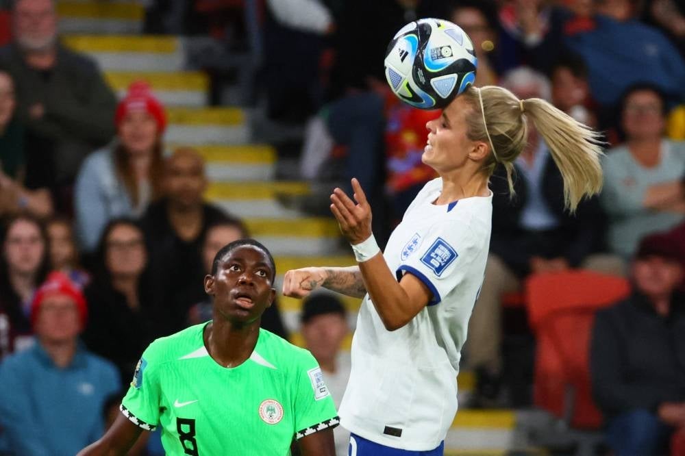 England's forward #09 Rachel Daly heads the ball during the Australia and New Zealand 2023 Women's World Cup round of 16 football match between England and Nigeria at Brisbane Stadium in Brisbane on August 7, 2023. (Photo by Patrick Hamilton / AFP)