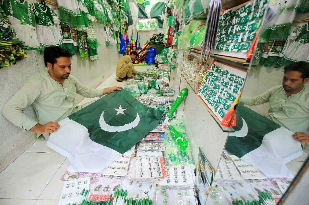 A Pakistani vendor sells national flags and items with the colors of the national flag at a market as the nation prepares to celebrate Independence Day, in Peshawar, Pakistan, 09 August 2023. PHOTO BY EPA/ARSHAD ARBAB