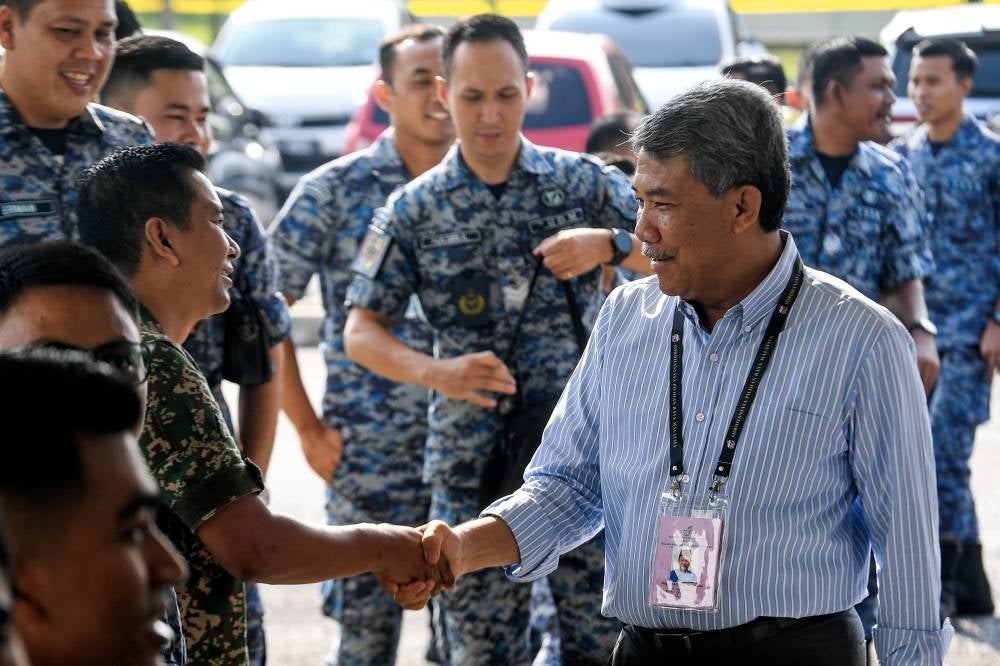 As Defence Minister, Datuk Seri Mohamad Hasan visits the Sendayan Airbase during early voting on Aug 8. He is BN's face for the state as he is the former Negeri Sembilan Menteri Besar and Rantau incumbent. 