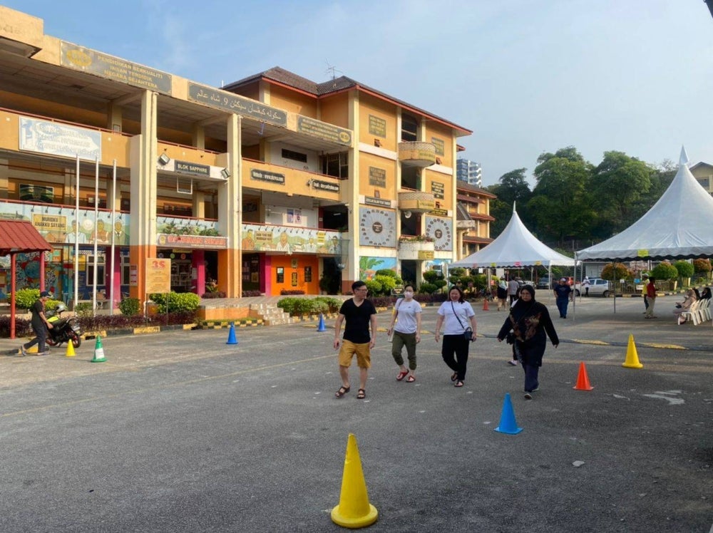 Another voter, Mohamad Azarif Abdul Aziz, 30, explained that despite the early wake-up call, he is taking part in the electoral process as a responsible member of the Shah Alam community. - Photo by ATHIRA AMINUDDIN