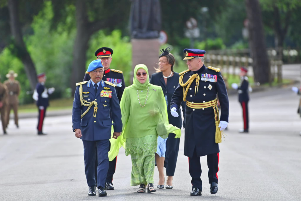 The Yang di-Pertuan Agong Al-Sultan Abdullah Ri'ayatuddin Al-Mustafa Billah Shah (left) and Raja Permaisuri Agong Tunku Azizah Aminah Maimunah attended the commissioning of their son, Tengku Ahmad Ismail Mu'adzam Shah, at the Royal Military Academy Sandhurst (RMAS) in London. - Facebook