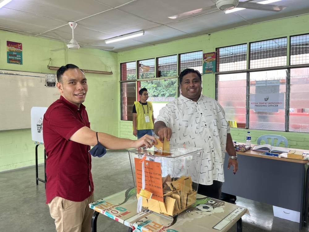 Pakatan Harapan's Rajiv Rishyakaran (right) is set to retain his Bukit Gasing seat as he currently leads the race with a majority of 23,141 votes. - Photo: FACEBOOK