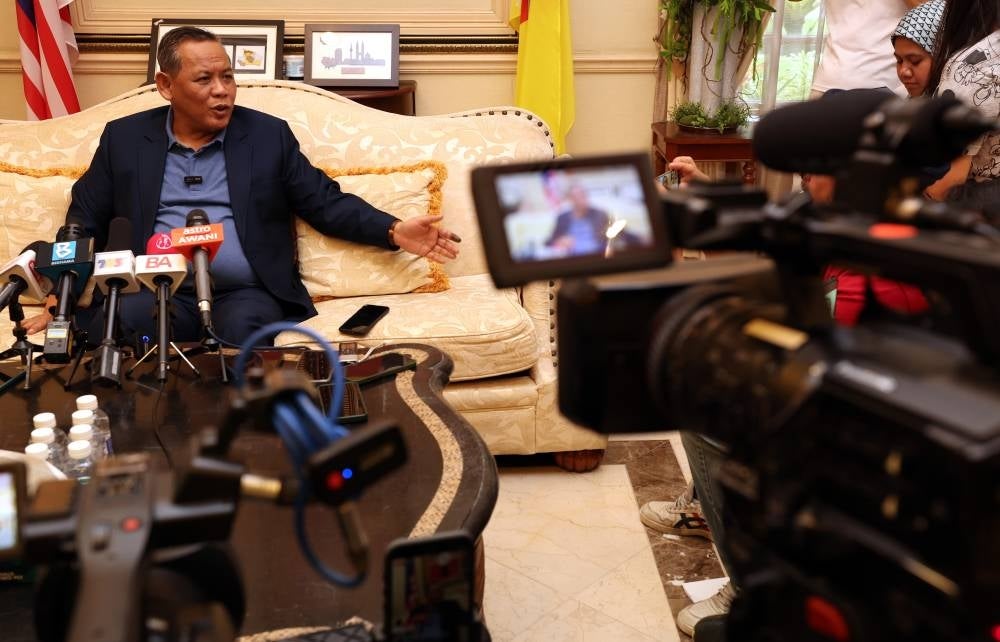 Pakatan Harapan chairman Datuk Seri Aminuddin Harun (left) in a press conference about the swearing in ceremony. - Photo by Bernama