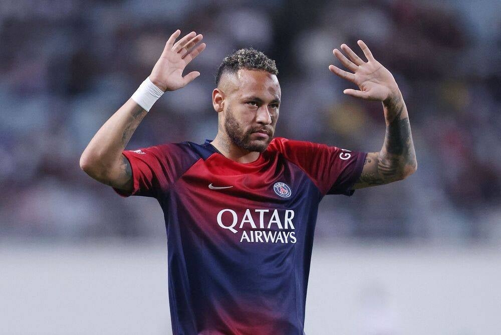 (FILES) Paris Saint-Germain's Neymar Jr waves to the crowd during a warm down following the friendly football match between France's Paris Saint-Germain and Saudi Arabia's Al-Nassr at Nagai Stadium in Osaka on July 25, 2023. (Photo by PAUL MILLER / AFP)