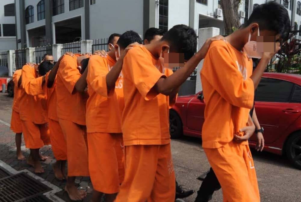 The students being brought to the Johor Bahru magistrate's court on Tuesday.
