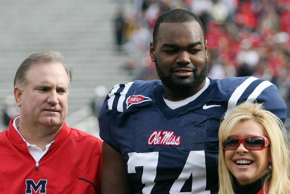 Michael Oher with Sean and Leigh Anne Tuohy before a game in Oxford, Mississippi, in 2008 - Photo by The Guardian