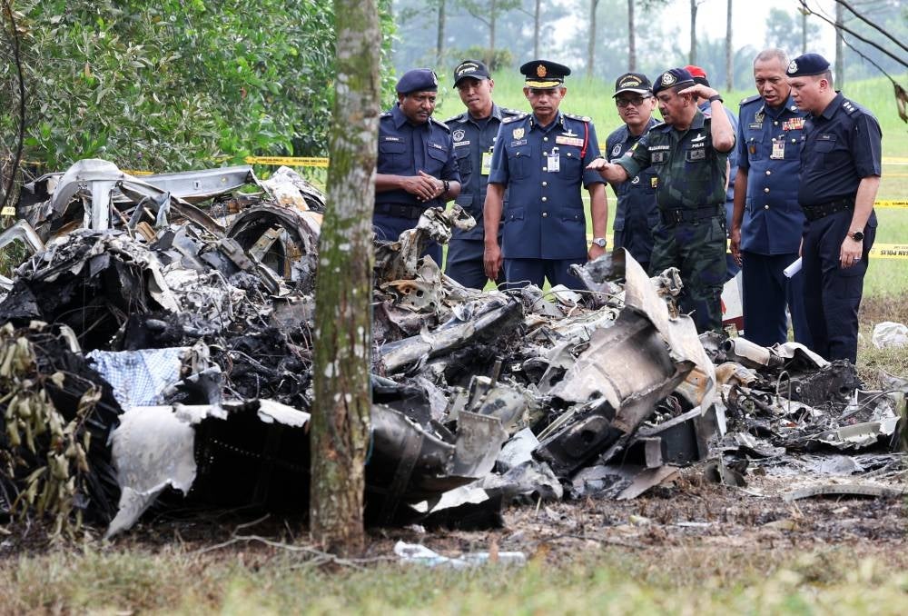 Inspector General of Police Tan Sri Razarudin Husain inspecting the crash site. Bernama FILE PIX