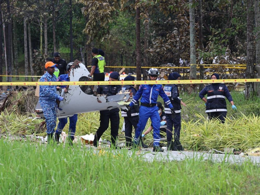 The wait is over today for the family members of the 10 victims who perished in Thursday’s plane crash on the Guthrie Highway, near the Elmina Township in Shah Alam, after all remains were identified and laid to rest. - Photo by Bernama